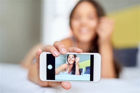 Wakey Wakey Rise And Shine A Beautiful Young Woman Taking Selfies On Her Bed At Home Stock