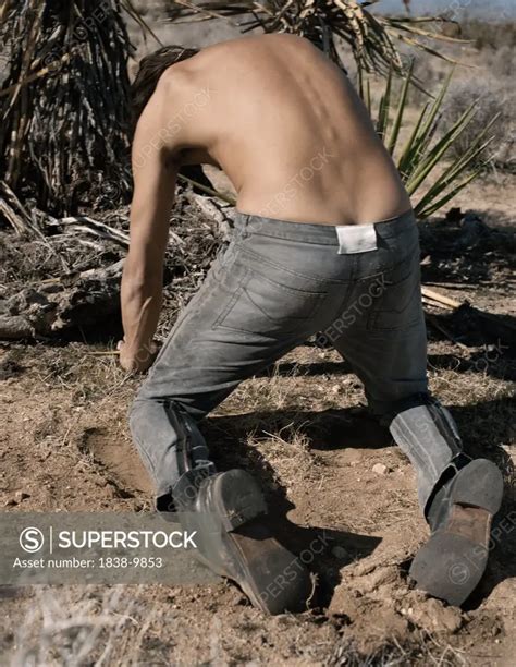 Shirtless Man On Hands And Knees Superstock