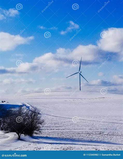 Windmill Turbine Behind A Farm In The Snow Stock Photo Image Of
