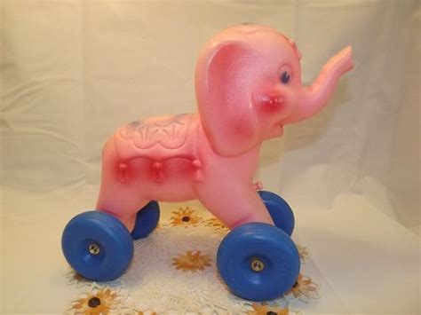 Polka dot ears and a large green bow. Hard to Find Regal Co Vintage Pull Toy Pink Elephant ...