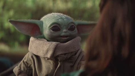 New Star Wars Concept Art Sees Baby Yoda Trying On A Mandalorians