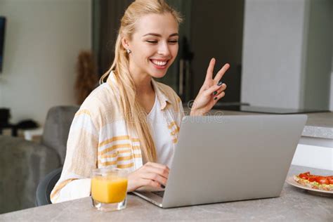 Lovely Smiling Young Girl On A Video Call Via Laptop Computer Stock