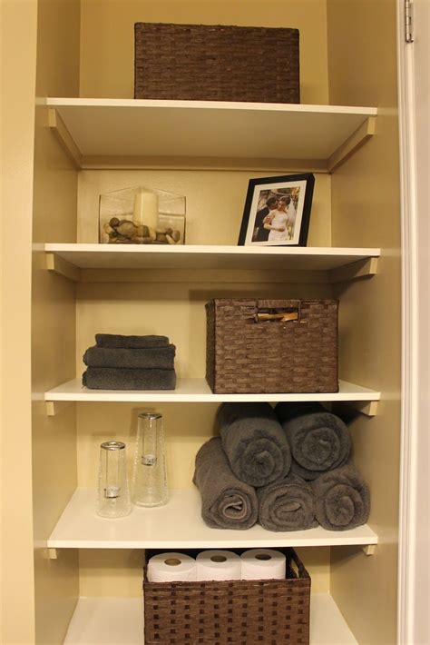 Simple closet storage ideas like this one can be used in a pinch and on a dime. KM Decor: DIY: Organizing Open Shelving in a Bathroom ...