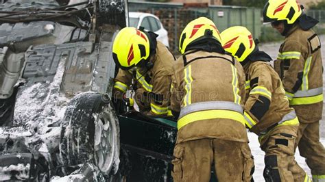 Firefighters Cutting Car Doors To Rescue Viction Of The Car Crash