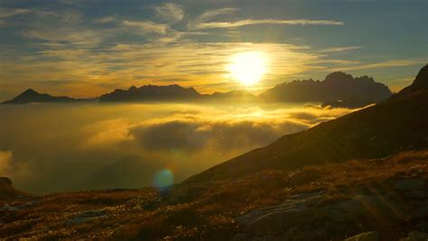 Aerial Sunset Above The Clouds On Top Of The Mountain Stock Footage