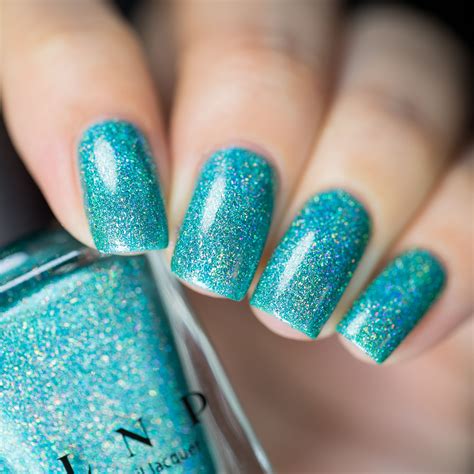 Many people do it on their own or visit renowned shops to have their nail arts. Beach House - Aqua Blue Holographic Nail Polish by ILNP in ...