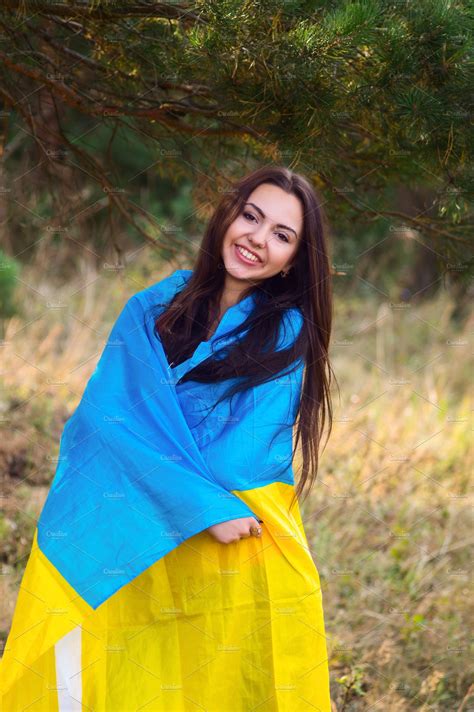 His servant of the people party went on to win early parliamentary elections in july, giving president zelensky control of both the executive and the legislature. Beautiful brunette model posing in a park with flag of ...