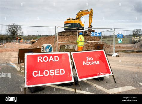 Road Closed Sign And Construction Workers Building A New Road England