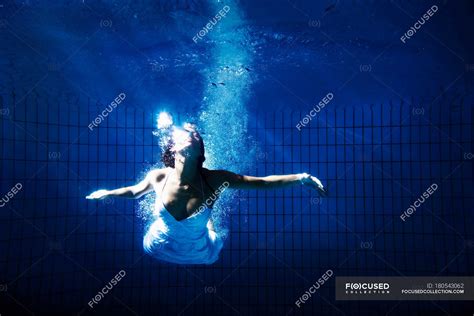 Woman In White Dress Underwater — Swimming Pool Front View Stock