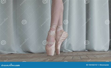 Ballet Dancer`s Feet As She Practices Pointe Exercises On The Parquet