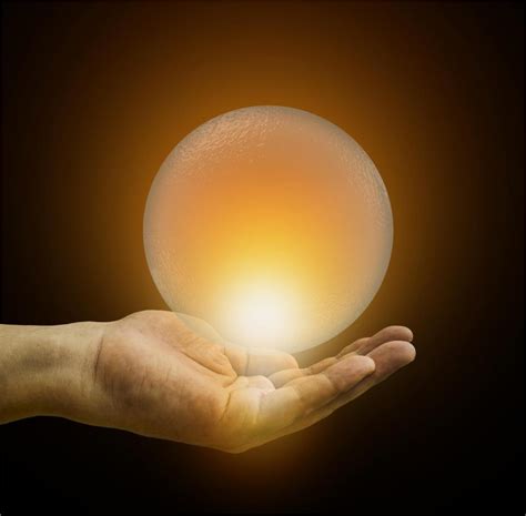 Free Stock Photo Of Hand Holding Glowing Crystal Ball Closer