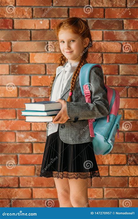 Cute Schoolgirl With Schoolbag Holds Textbooks Stock Image Image Of 7ca