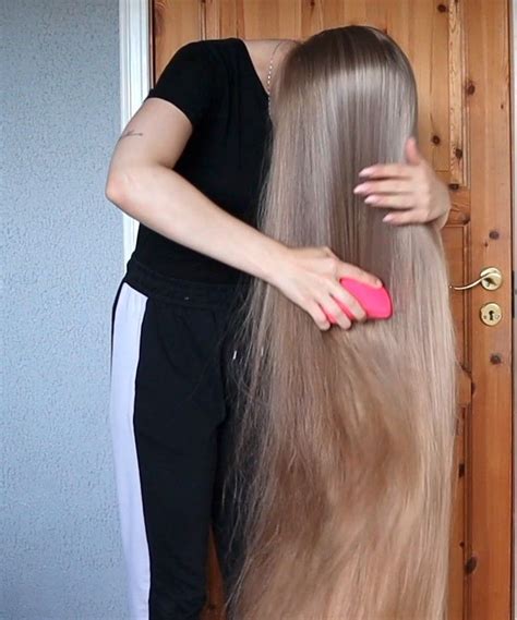 She Brushes Her Long Blonde Hair