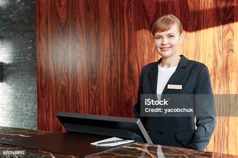 Hotel Receptionist Warmly Welcoming Guests Stock Photo Download Image
