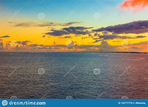 The Pacific Ocean At Dusk As The Sun Falls Below The Horizon Stock