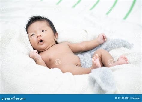 Newborn Infant Baby Boy Lying On A White Blanket Stock Image Image