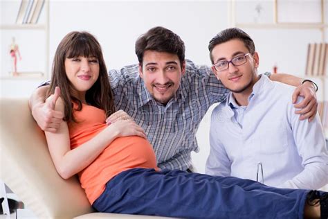 The Pregnant Woman With Her Husband Visiting The Doctor In Clinic Stock Image Image Of
