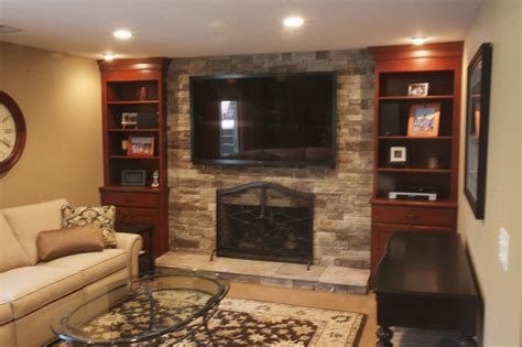 You can either cover the space between the 2 mantels with wood or not. Ledge Stone Fireplace & TV installed over existing brick ...