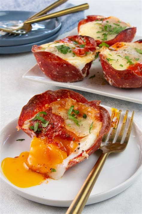 Using a small amount of the butter, butter two ramekins or 2 cup baking bowls. Keto Pizza Egg Cups - Low Carb and Delicious! 🍕🍳 - Keto Karma