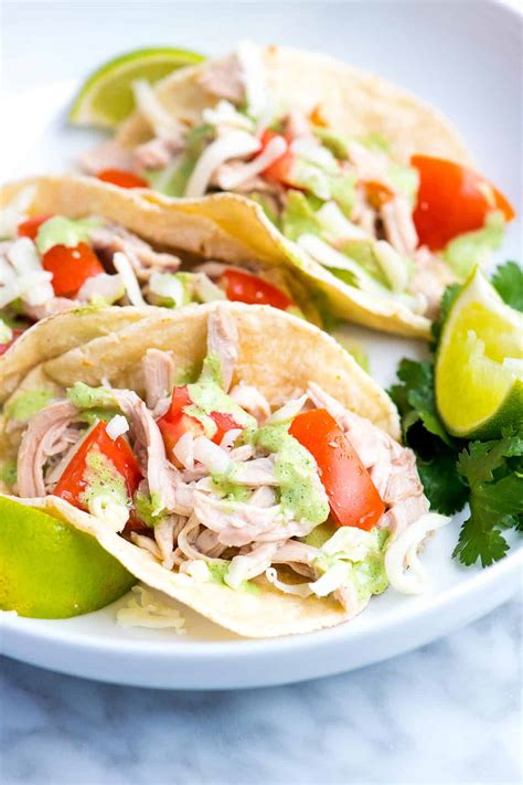 Heat the olive oil in a large skillet on medium heat and place the chicken in the skillet. Shredded Chicken Tacos with Creamy Cilantro Sauce