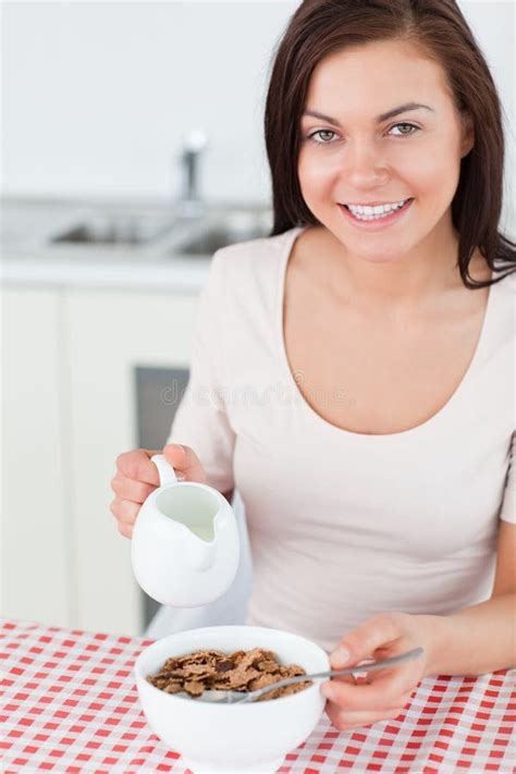 Portrait Of A Brunette Pouring Milk In Her Cereal Stock Image Image Of Healthy Milk