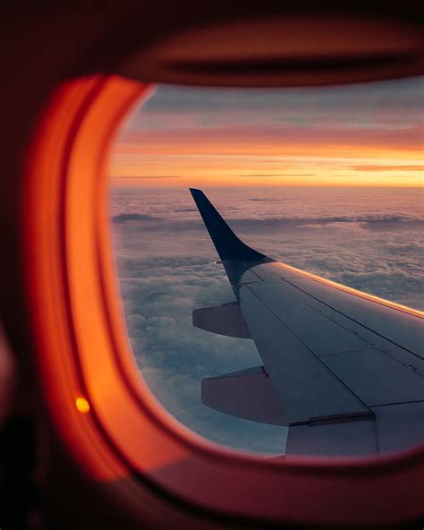 Airplane Porthole Wing Sunset Clouds Sky Hd Phone Wallpaper Peakpx