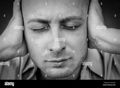 Stressed Man Covering His Ears Black And White Stock Photos And Images