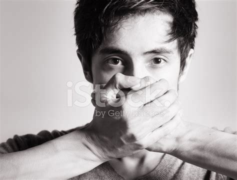 Man With Hands Covering Mouth Stock Photo Royalty Free Freeimages