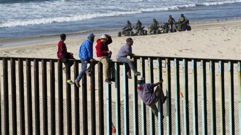 Migrants Are Scaling Us Mexico Fence Will They Be Arrested The