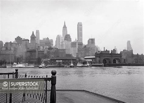 1930s Skyline Of Lower Manhattan Business District Sight Seeing Boats Terminal Slips From Deck
