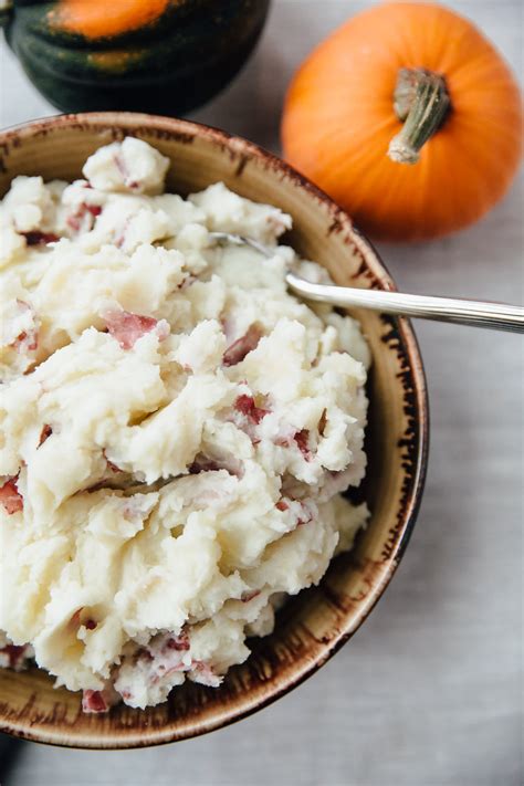 I like to drain the potatoes and place them back in the pot over very low heat to make sure that any liquid or steam is released while you're mashing them. Recipe: Stovetop Rustic Garlic Mashed Potatoes | Kitchn