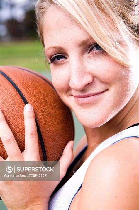 A Portrait Of An Athletic Woman Playing Basketball Superstock