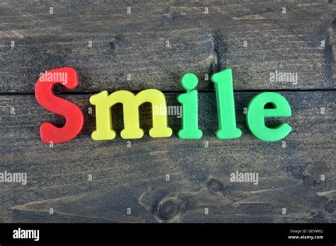 Smile Word On Wooden Table Stock Photo Alamy