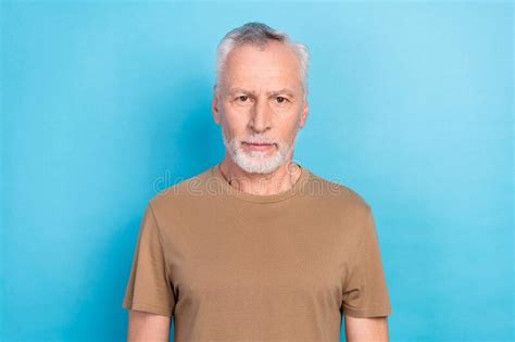 Portrait Of Handsome Confident Serious Man With Gray Hair Beard Dressed