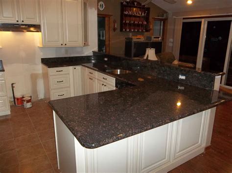 Granite counters are fabricated to have finished edges and sink cut outs that can be standard, or custom made for the. Measure for a Tan Brown Granite Countertops in 2020 | Tan ...