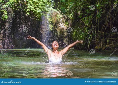 Attractive Happy White Tourist Woman Enjoying Playing With Water And