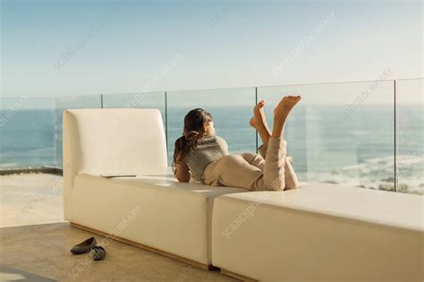 Woman On Luxury Balcony Relaxing Stock Image F Science Photo Library