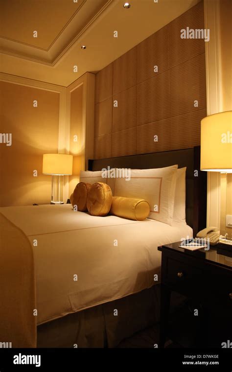 Luxury Hotel Room At Night In Bedroom Stock Photo Alamy