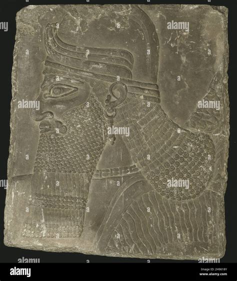 Relief Showing The Head Of A Winged Genius Neo Assyrian Period Reign