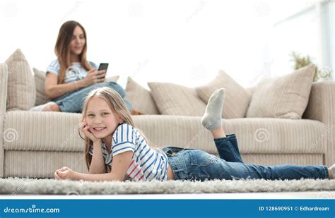 Mom And Her Daughter Are Resting In The New Living Room Stock Image Image Of Beautiful