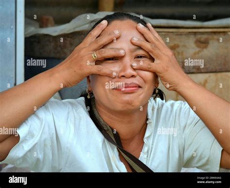 Flirting Mature Indonesian Javanese Woman Pretends To Cover Her Eyes With Both Hands And Mocks