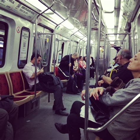 many people are sitting on the subway train