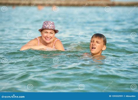 Grandmother And Grandson Swim Together In Sea Stock Image Image Of