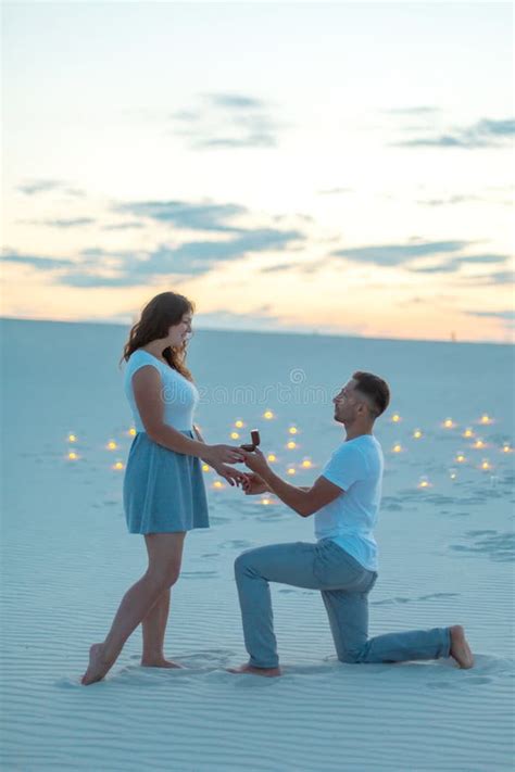 Couple In Love Romantic Hugs In Sand Desert Evening Romantic Atmosphere In Sand Burn Candles