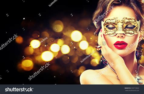Beauty Model Woman Wearing Venetian Masquerade Carnival Mask At Party Over Holiday Dark