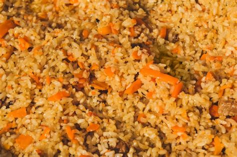 Premium Photo Rice Pilaf With Meat Carrot And Onion