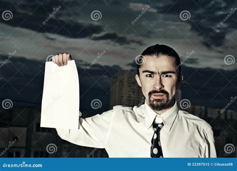 Serious Businessman Holding A Sheet Of Paper Stock Image Image Of