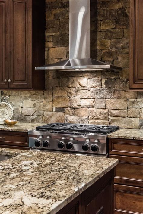 This space has a unique countertop paired with white cabinets. 29 Cool Stone And Rock Kitchen Backsplashes That Wow ...