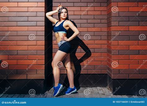 Beautiful Fitness Model Posing Against A Brick Wall Background Stock Image Image Of Person