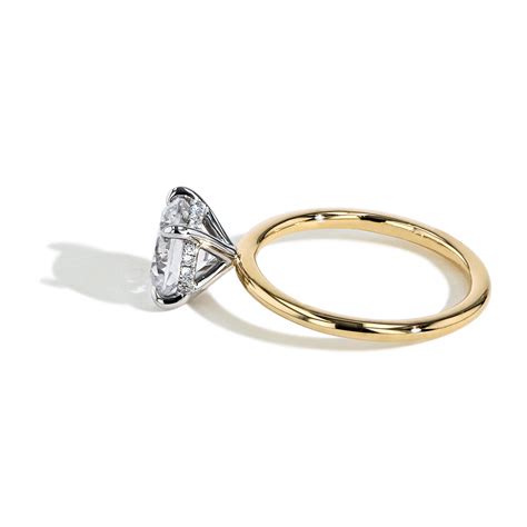ultra thin round hidden halo solitaire engagement ring setting in yellow gold